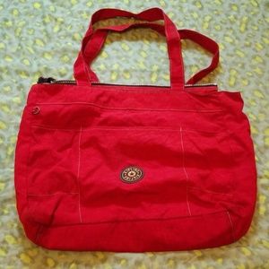 Kipling red carry on duffle bag